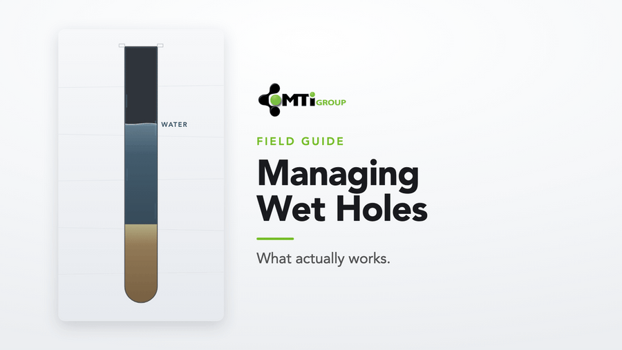 Cross-section of a wet blast hole: water in the column over an ANFO charge — MTi Group Managing Wet Holes field guide