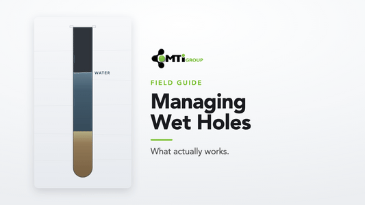 Cross-section of a wet blast hole: water in the column over an ANFO charge — MTi Group Managing Wet Holes field guide