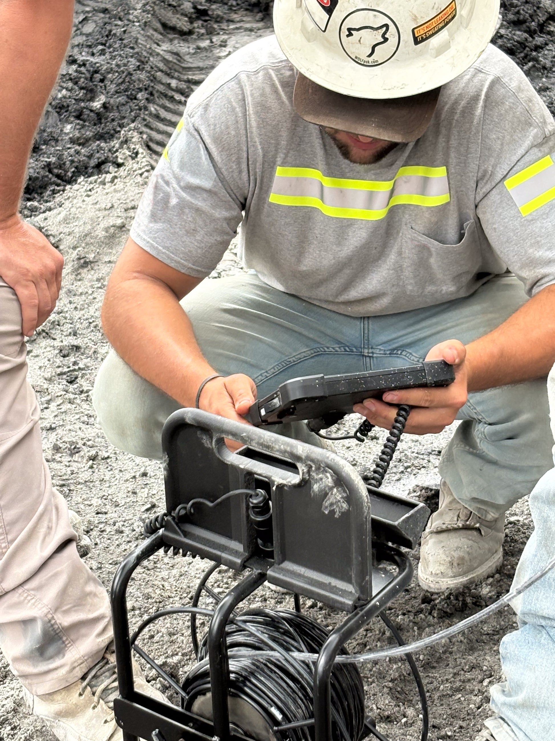 blasting crew inspecting borehole integrity with the downhole camera
